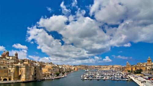 a view of a city with boats in a harbor at Traditional Maltese Townhouse wt Terrace and Pool in Senglea