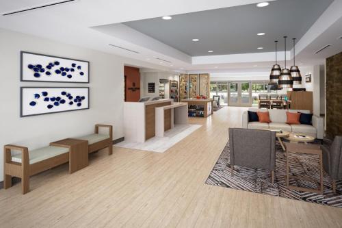 a living room with a couch and a table at Candlewood Suites - Layton - Salt Lake City by IHG in Layton
