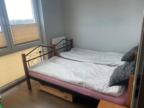 Cama o camas de una habitación en Hostel pracowniczy ORBITA