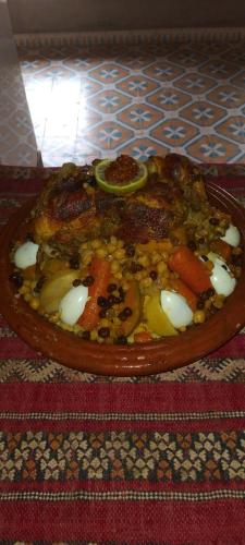 a plate of food sitting on a table at Maggaman Guest House in Tafraoute Sidi Ali