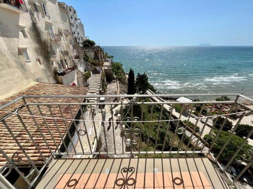 a stairway leading down to the ocean from a building at Florenza Residence in Sperlonga