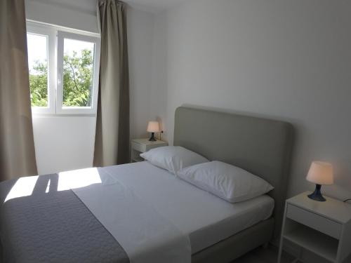 Postel nebo postele na pokoji v ubytování Apartment Salvia