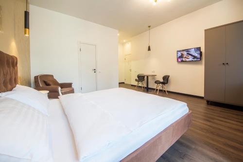 Кровать или кровати в номере Central Apartments Palats Sportu Area
