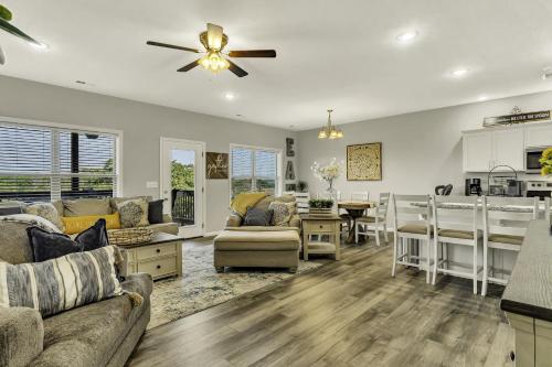 a kitchen and living room with a couch and a table at Sunset Bunker condo in Branson West