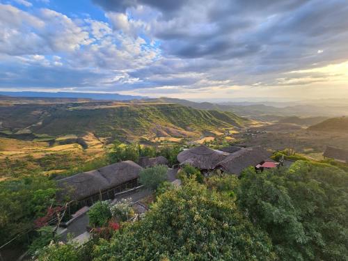 an aerial view of a village in the hills at Sora Lodge Lalibela in Lalībela