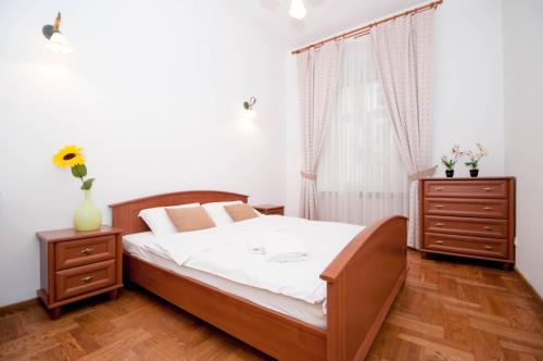 Кровать или кровати в номере Central Apartments Palats Sportu Area