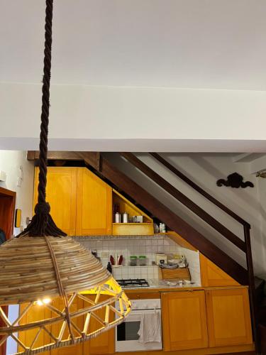 a light hanging from a ceiling in a kitchen at Porta degli Elfi-Residence San Vito in Pescocostanzo