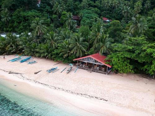 an aerial view of a resort on a beach at White Beach Front and Cottages in Buruanga