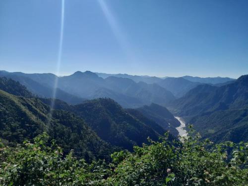 a view of a valley in the mountains at Clan Boho in Rishīkesh