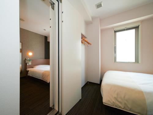 Katil atau katil-katil dalam bilik di Super Hotel Shinjuku Kabukicho