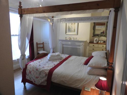 Ένα ή περισσότερα κρεβάτια σε δωμάτιο στο Beaches Guesthouse