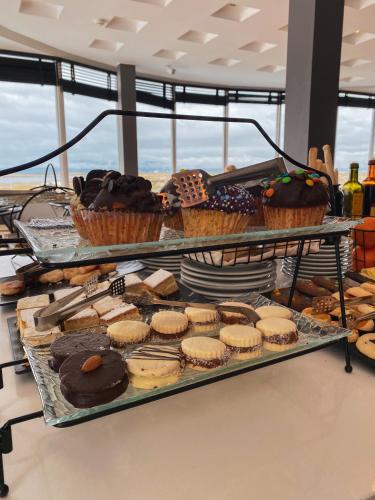 a display of different types of pastries and cakes at Alto Andino Hotel in Ushuaia