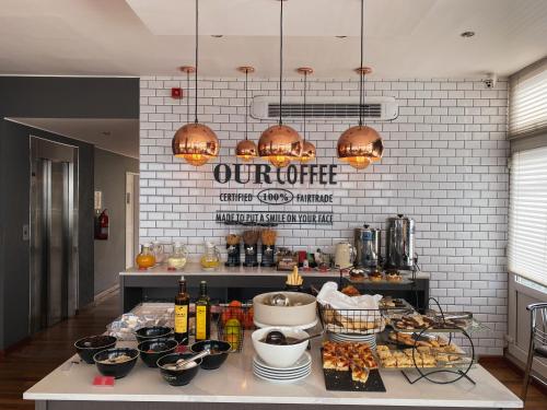 a kitchen with a counter with food on it at Alto Andino Hotel in Ushuaia