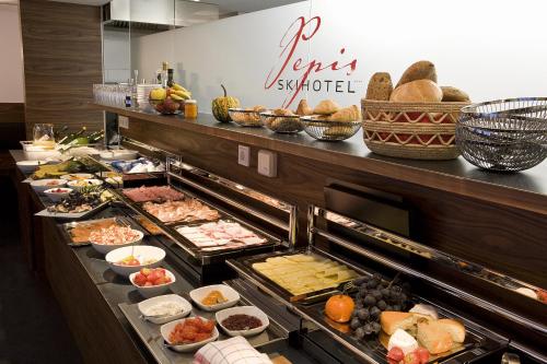 a buffet line with many different types of food at Pepis Skihotel in Sankt Anton am Arlberg
