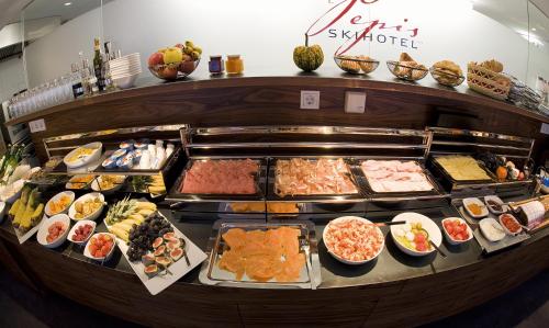 a buffet filled with lots of different types of food at Pepis Skihotel in Sankt Anton am Arlberg