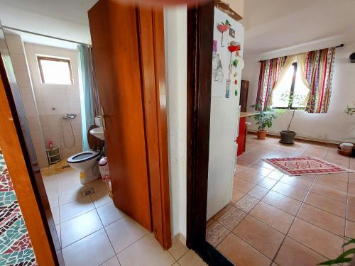 a bathroom with a toilet in a room at Impeccable apartment with view in Dolna Matka in Skopje