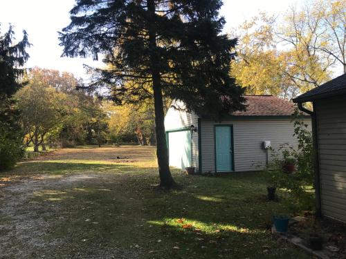 a house with a tree in the yard at Hope Bed and Breakfast in Canton