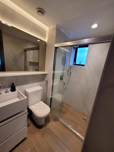 a bathroom with a shower and a toilet and a sink at Hotel Bourbon Ibirapuera Suite 5 estrelas Moema in São Paulo