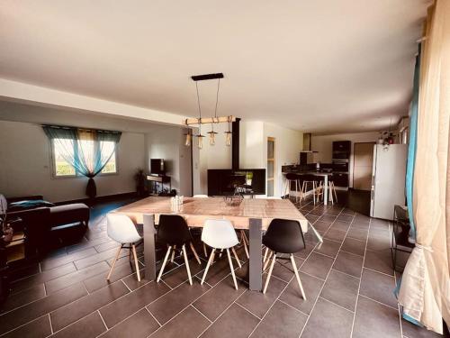 a kitchen with a large wooden table and chairs at Entre Nous in Vironchaux