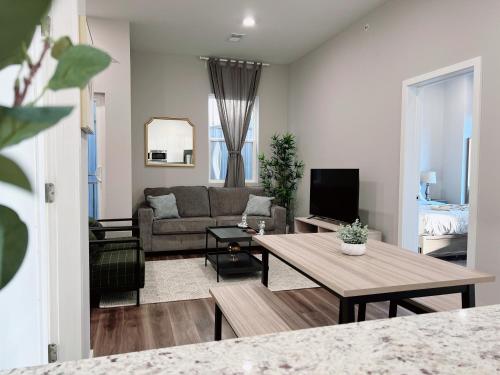 a living room with a couch and a table at Stay at Luna on Ridge Ave in Philadelphia