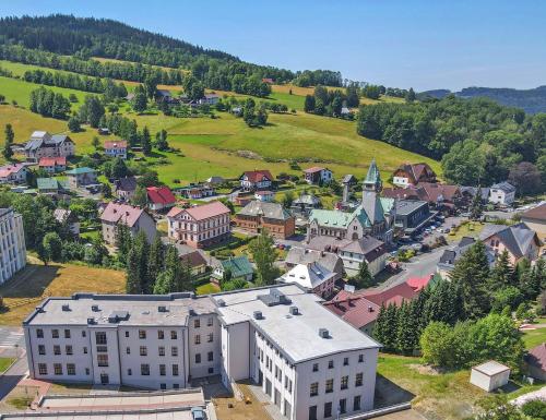 an aerial view of a small town with buildings at Residence Lysá Hora in Rokytnice nad Jizerou