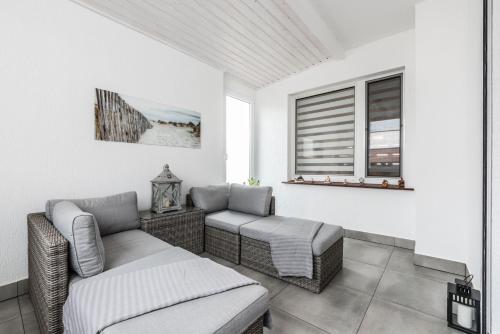 a living room with two couches and a window at Villa House Poznań * SAUNA * in Poznań