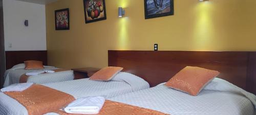 Postel nebo postele na pokoji v ubytování Hotel Villonaco