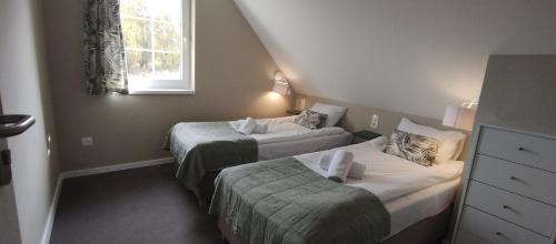 Una cama o camas en una habitación de Róża Sudetów Domek