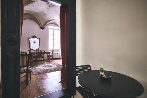a room with a table and a dining room at Affittacamere San Teodoro in Albenga