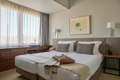 Postel nebo postele na pokoji v ubytování Hotel Dom Carlos Park