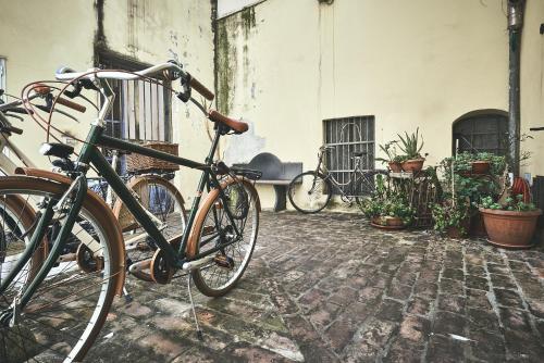 a bike parked next to a building with plants at Affittacamere San Teodoro in Albenga
