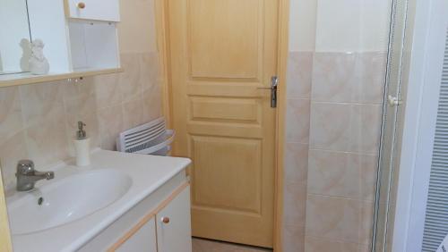 a bathroom with a sink and a shower at Charme Le Cadran Solaire classé 4* in Sancey-le-Long