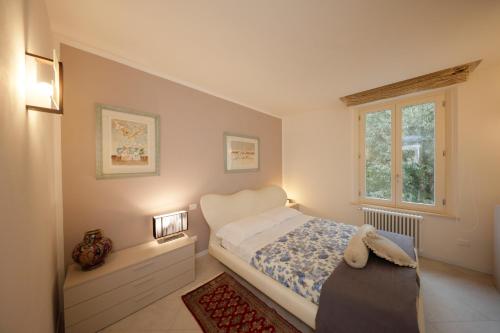 Ένα ή περισσότερα κρεβάτια σε δωμάτιο στο Siena UpTown - Sabrina's Charming Apartment