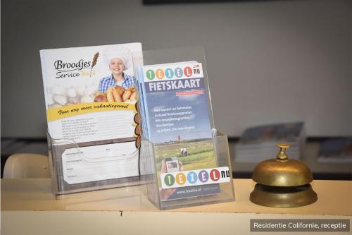 two boxes sitting on top of a table at Residentie Californië in De Koog