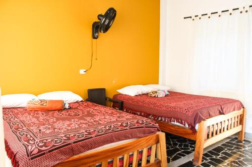 Katil atau katil-katil dalam bilik di Hermosa casa de campo con piscina en Pereira