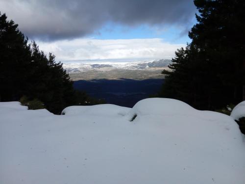 a pile of snow on the side of a mountain at CASA GORDON in Navaluenga