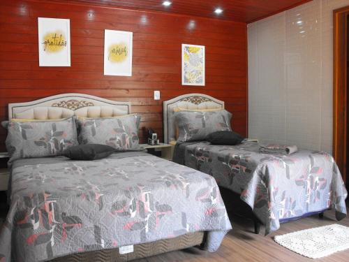Una cama o camas en una habitación de Pousada Cascata dos Amores