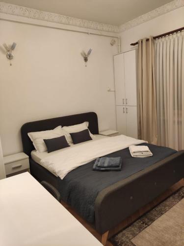 a bedroom with a large bed in a room at Royal Studio in Old Town in Bucharest