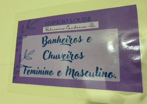 a sign on a wall that says barlisheslisheslisheslisheslishesumersitime at Pousada Louise in Balneário Camboriú