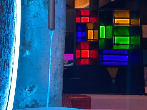 a water fountain in front of a colorful wall at ilpostonascosto in Isernia