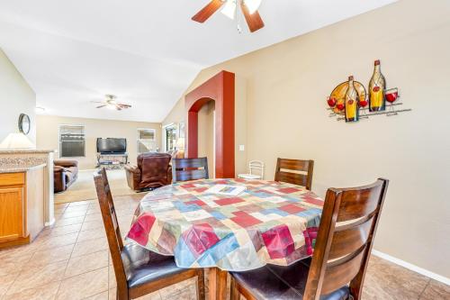 a dining room with a table and chairs at Good Times in Goodyear in Goodyear
