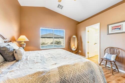 a bedroom with a large bed and a window at Good Times in Goodyear in Goodyear