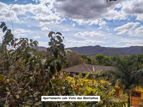 a view of a house with mountains in the background at Sanctuary Pirenópolis Suítes e Flats in Pirenópolis