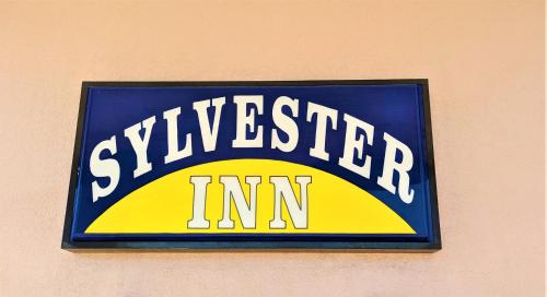 a sign on the side of a building at Sylvester Inn in Sylvester