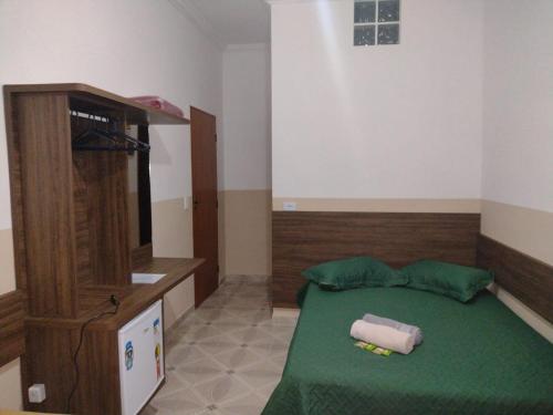 Ένα ή περισσότερα κρεβάτια σε δωμάτιο στο Pousada Bela Rainha