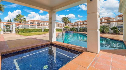 a swimming pool in a villa with a resort at Breakers Block 5 Unit 6 in Yamba