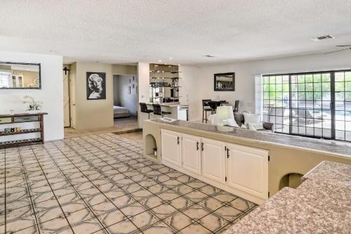 an open living room with a kitchen and a living room at Bright Indio Home with Pool about 2 Mi to Coachella in Indio