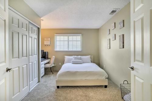 a bedroom with a bed and a desk in it at Bright Indio Home with Pool about 2 Mi to Coachella in Indio