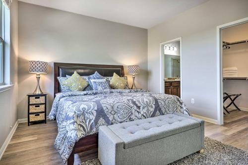 a bedroom with a large bed and a couch at Charming Buda Home about 19 Mi to Downtown Austin in Buda