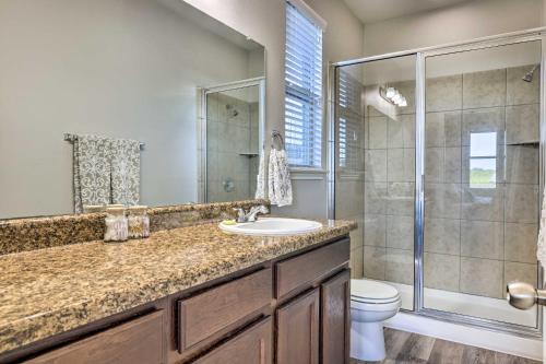 a bathroom with a shower and a sink and a toilet at Charming Buda Home about 19 Mi to Downtown Austin in Buda